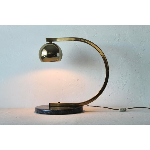 1980s Vintage George Kovacs Style Brass Finish Eyeball Table Desk Lamp with a Marble Base. Fabulous Italian style form. In...