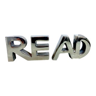 1980s Retro Styled Silver Metal Bookends That Spells Read - Set of 2 For Sale