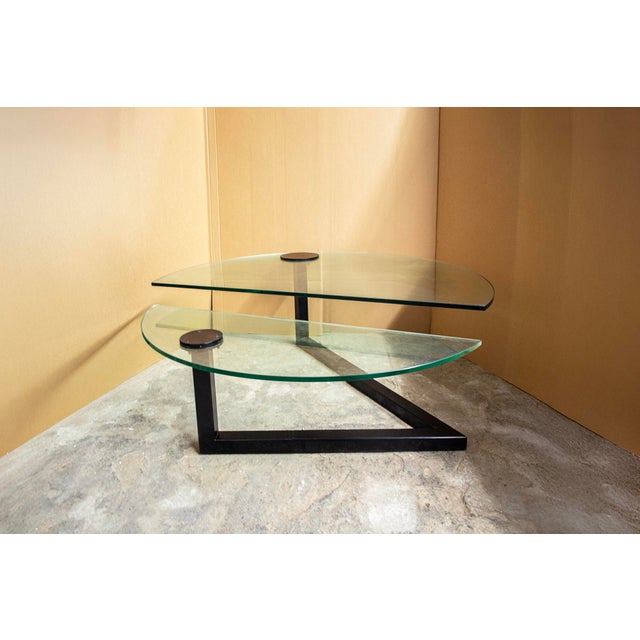 Coffee table with lacquered metal structure and glass top. Karate model Designer Carlo Forcolini Producer Alias Year 1985...