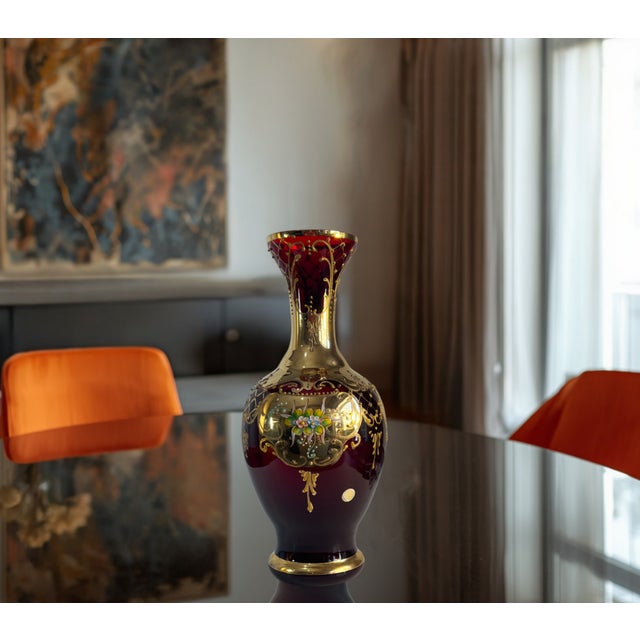 This 12‑inch Venetian art glass vase is a richly ornate example of traditional Italian luxury, glowing in a vivid...