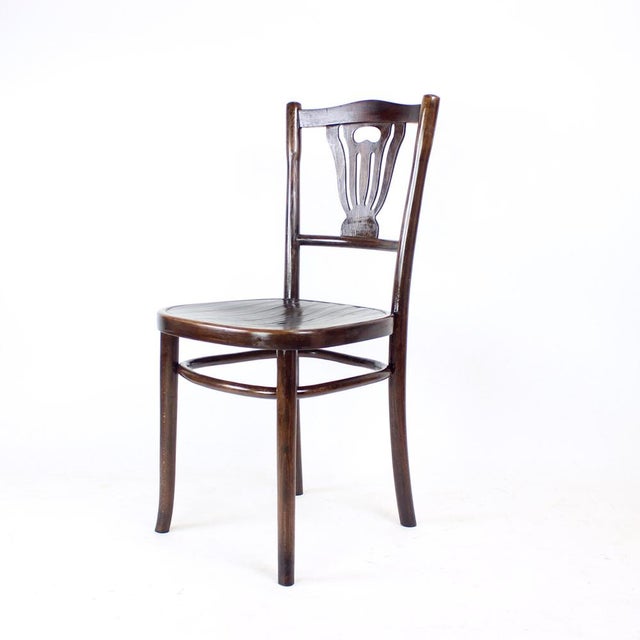 Beautifully restored vintage bistro chair produced by TON in Czechoslovakia during the 1950s. The label is no longer...