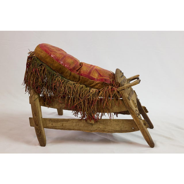 This is an exceptional example of a tribal ceremonial camel saddle, likely originating from North Africa or the Middle...