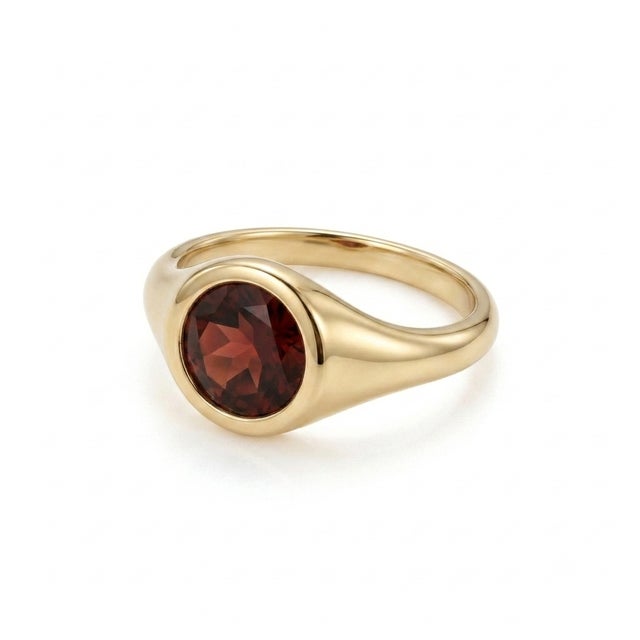Elevate your daily jewelry collection with this rich and alluring Natural Red Garnet signet ring. Designed with a smooth,...