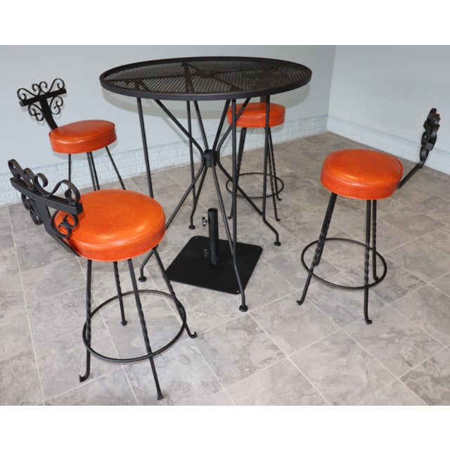 Spanish Revival Vintage Spanish Revival Wrought Iron Swivel Bar Stool Set With Matching Mesh Bar Table & Heavy Umbrella Stand – Mid-Century, Orange Vinyl For Sale - Image 3 of 12