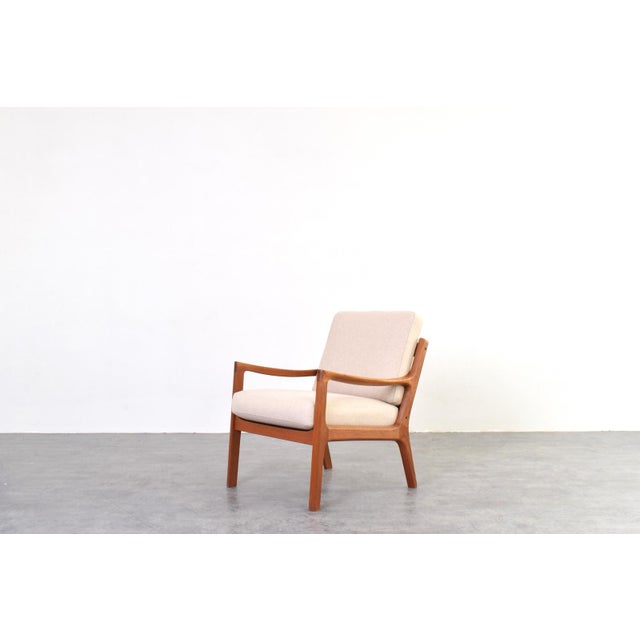 This armchair designed by Ole Wanscher and produced by Cado in Denmark during the 1960s is a refined example of mature...