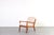 This armchair designed by Ole Wanscher and produced by Cado in Denmark during the 1960s is a refined example of mature...