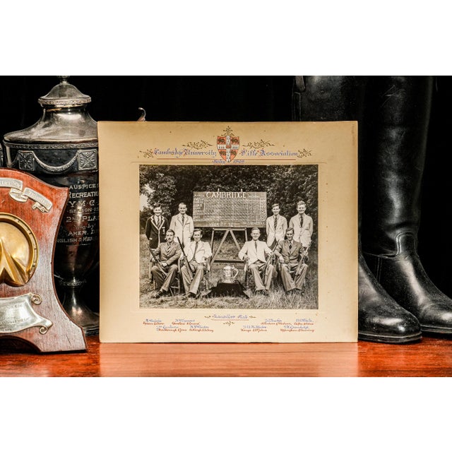 This 1949 Cambridge University Rifle Association antique photograph exudes a sense of tradition and achievement, offering...