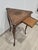 An elegant and original triangular tripod side table made in the early 20th century by the prestigious cabinetmaking firm...