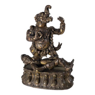 17th or 18th Century Chinese Sino-Tibetan Gilt Bronze Buddhist Makala Faced Deity Figure For Sale
