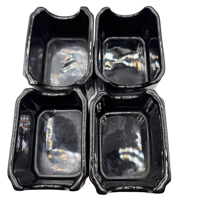 This coordinated Neo Art Deco set, stamped 1981, features a striking glossy black finish and strong geometric forms...