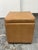 Design Plus Gallery presents the Briggs Storage Ottoman by Grandin Road. This square ottoman has a caramel-toned faux...