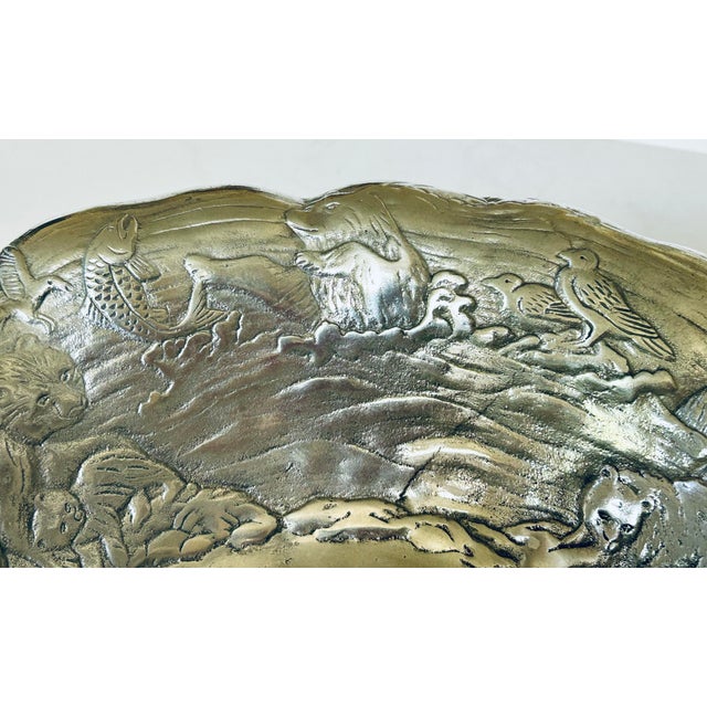 From California designer Arthur Court, this serving bowl with embossed bear scenes on the inside and etched scenes on the...