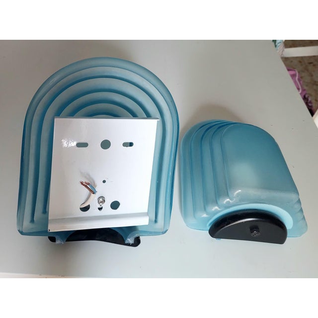 A rare pair of mid century murano frosted glass wall lamps from the 70's. Made by the venetian glass master's of mazzega....