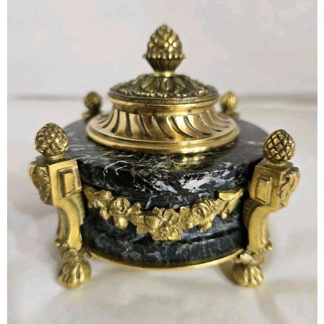 A fine late 19th-century French gilded ormolu inkwell stand, standish or decorative paperweight dating to circa 1870–1880,...