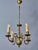 An elegant smaller antique bronze chandelier from flanders, dating back to around the mid-19th century. The chandelier is...