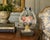 Charming vintage cast iron doorstop modeled as an overflowing basket of flowers beneath an arched handle tied with a bow....