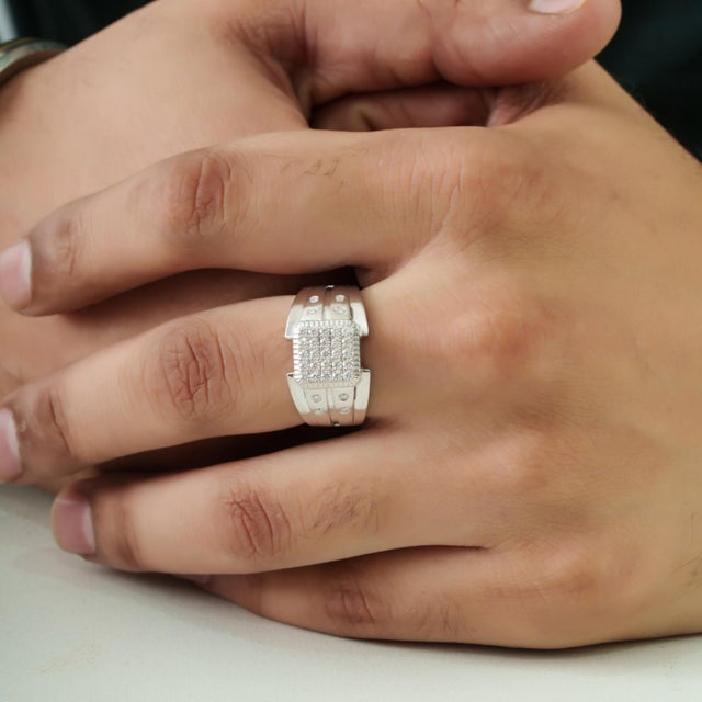 The Modernist Heavy Sterling Silver Unisex Wide Band Ring features a bold, wide-band design adorned with round pavé-set...
