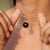This black Star Drop Pendant is finely crafted in 925 Sterling Silver. Featuring a captivating 5.71 carat round Black Star...