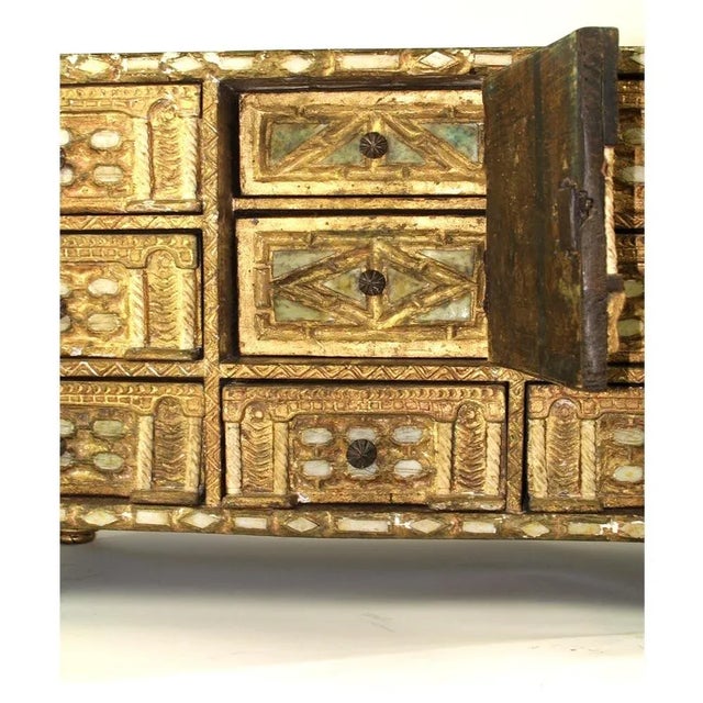 Gilded wood with bone inlay. This Spanish piece is from the late 18 century. It has some chipping and one piece of bone...