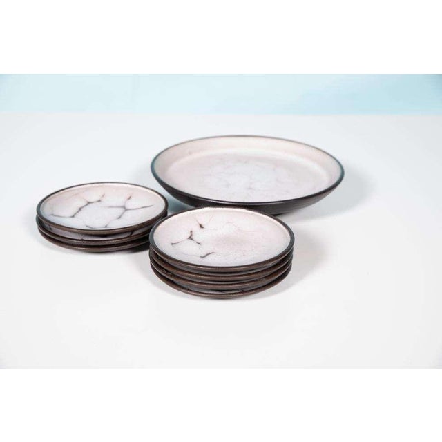 Beautiful set made by the Dutch Mobach Utrecht in the 1960s. The set consists of a serving bowl and seven matching bowls....