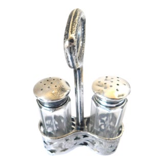 Antique Sterling Salt and Pepper Shakers in Sterling Openwork Floral Holder With Handle For Sale