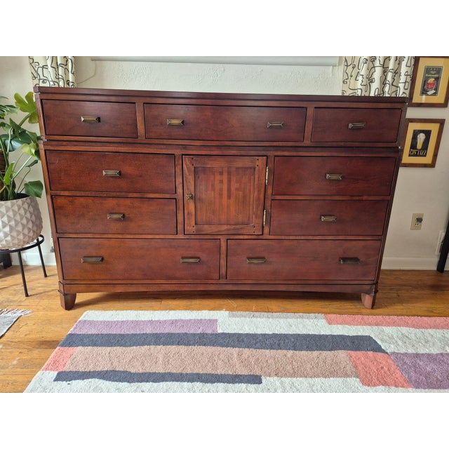 This high-quality dresser and matching mirror set is built with premium cherry wood and finished in a rich, warm tone. It...