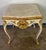 19th Century French Rococo style white colored painted & parcel gilt table. The Rococo style flourished in Europe,...