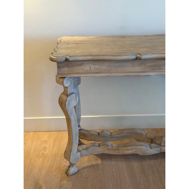 A 20th-century French wood console table crafted from Beechwood. Made in Spain, this piece reflects classic French design...