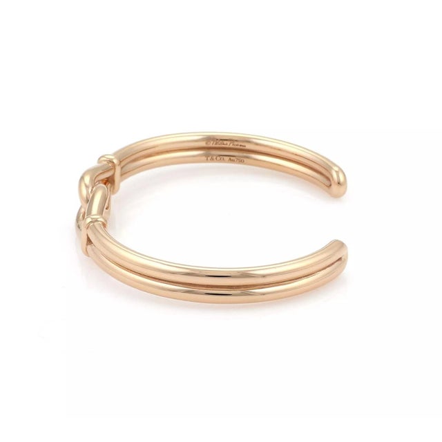This beautiful authentic cuff bracelet is from Tiffany & Co. by designer Paloma Picasso, it is crafted from 18k rose gold...