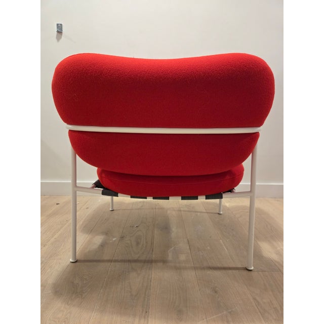 The Fogia Bollo Armchair in red fabric combines Scandinavian craftsmanship with a playful, modern silhouette. Designed for...