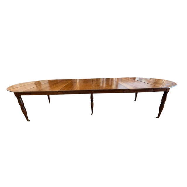 Early 19th Century Louis XVI or Directoire Style French Provincial Extending Dining Table. Rich golden brown colored...