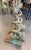 A pair of fine and large cast bronze figural doorstops in the form of a dolphin or serpent with tail wrapped around a...