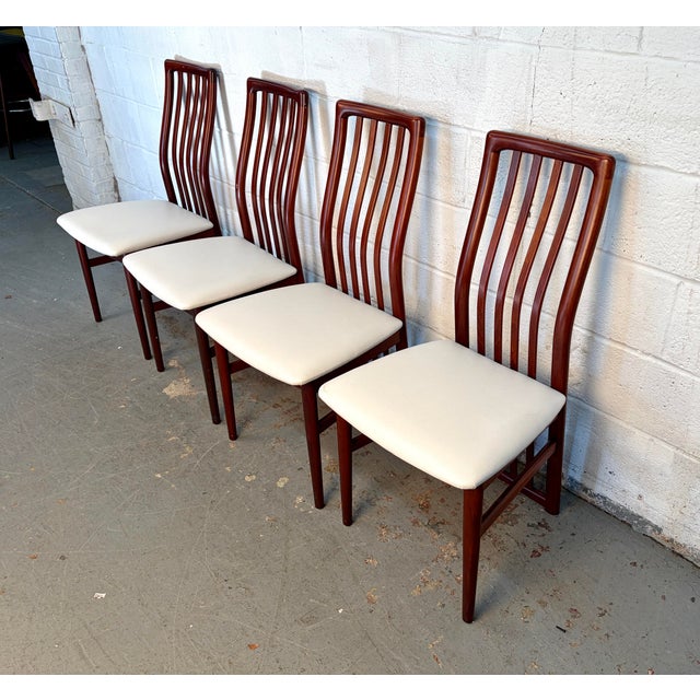 This is an absolutely stunning set of four vintage Danish Mid-Century Modern dining chairs, attributed to the esteemed...