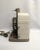 A 1950s Bell & Howell movie projector. The super 8mm film projector is a model #253 AX. The projector features a metal...