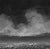 This artwork presents a dramatic skyscape, where billowing clouds dominate a moody, monochromatic horizon. The textured...