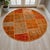 This sophisticated circular patchwork rug is a masterclass in the art of repurposing, bringing together hand-knotted...