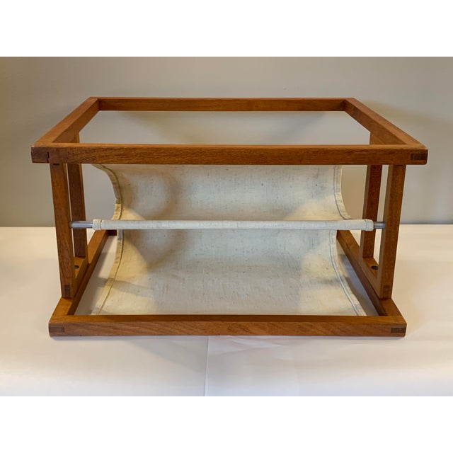 Danish modern style teak and linen two-pocket magazine rack. Here’s a chance to solve your storage need with elegance and...