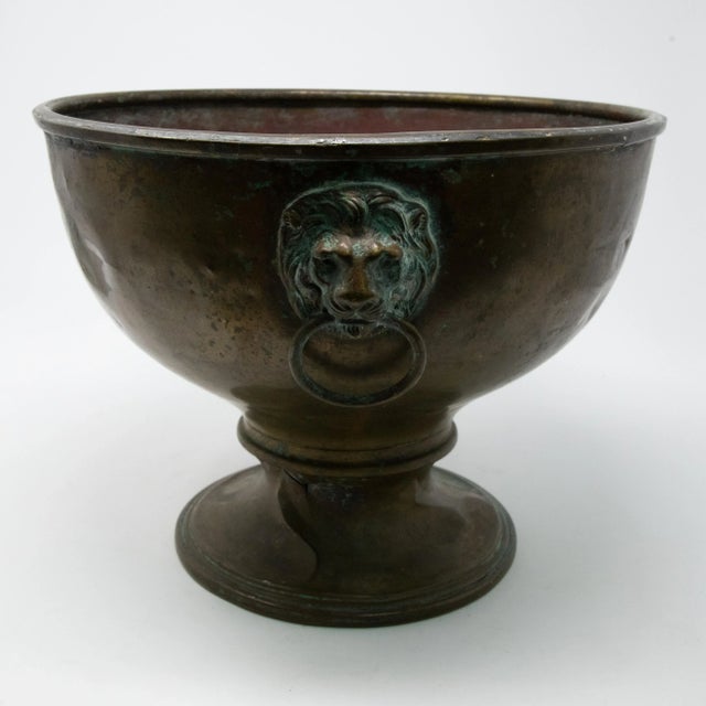 Offering this beautiful Brass planter with lions heads. Starting on the bottom with a simple rounded plinth like base....