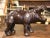This beautiful, antique hippopotamus sculpture was crafted in France, circa 1920. The detailed leather figure standing on...