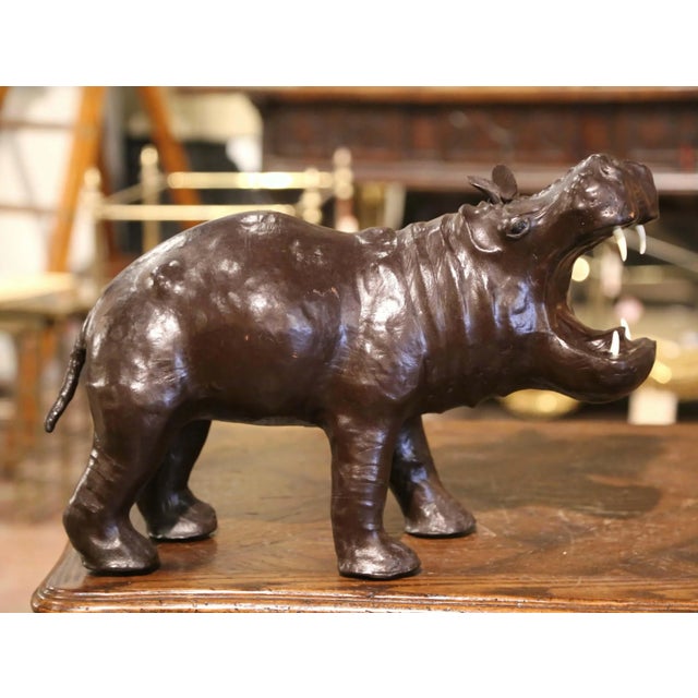 Add sculptural character and an exotic accent to a study, library, or living room with this striking antique hippopotamus...