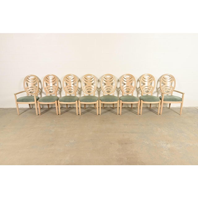 An outstanding set of eight modern Art Deco style dining chairs By Henredon USA, Circa 1980s Carved pickled oak frames,...
