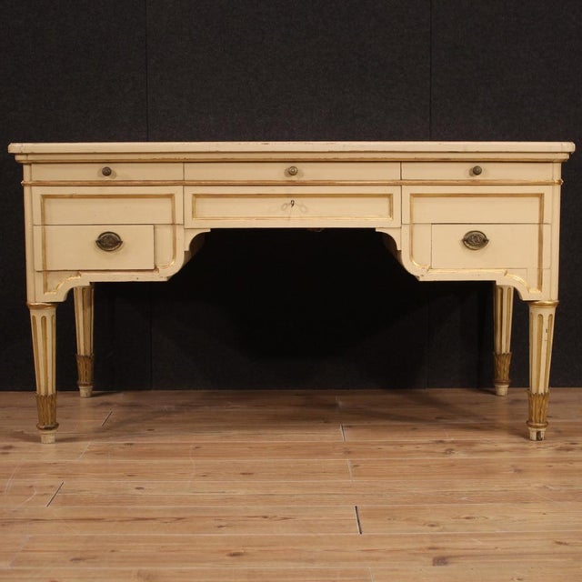 Italian writing desk from the mid-20th century. Furniture in carved, lacquered and gilded wood of beautiful lines and...