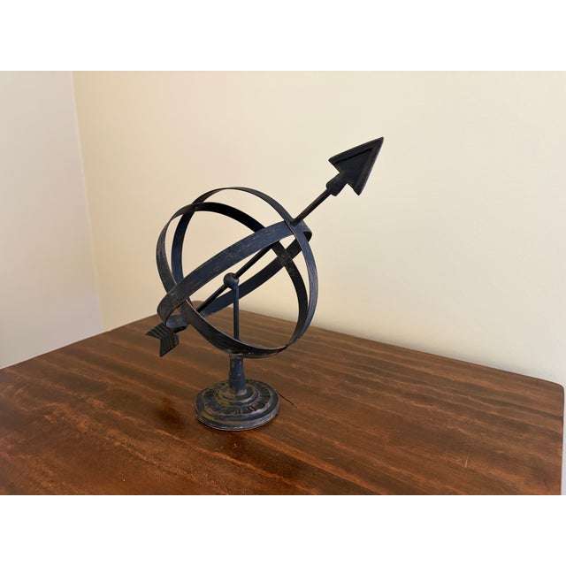 A beautifully crafted iron armillary sphere, evoking the timeless elegance of classical European gardens. Pieces like this...