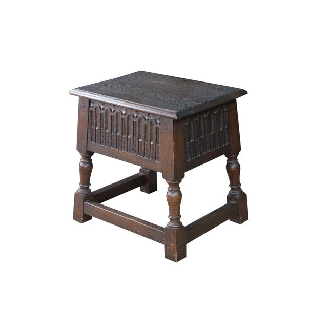This is a handsome early 20th-century English oak joint stool, beautifully crafted in the traditional Jacobean Revival...