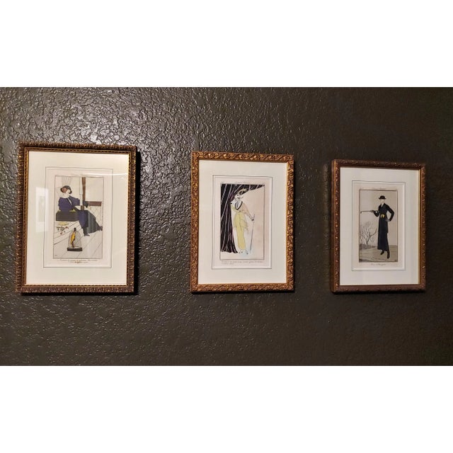 Three stunning and rare hand-painted engravings depict Parisian couture at the height of the Belle Epoque and Art Nouveau...