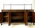 An exceptionally grand and narrow-profile Regency Revival sideboard attributed to Theodore Alexander. This masterfully...