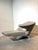 Sculptural and highly recognizable Parabolica lounge chair by Leolux . This iconic design piece combines a flowing chaise-...