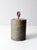 This heavy vintage cast iron weight features a thick cylindrical form with deep grooves and a fixed looped handle at the...