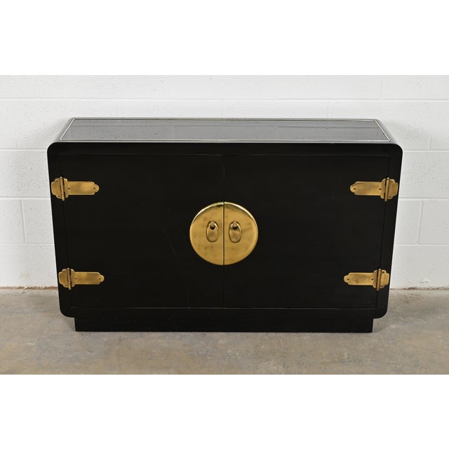 A gorgeous mid-century modern Hollywood Regency bar cabinet, sideboard, or bookcase By Mastercraft USA, 1970s Black...