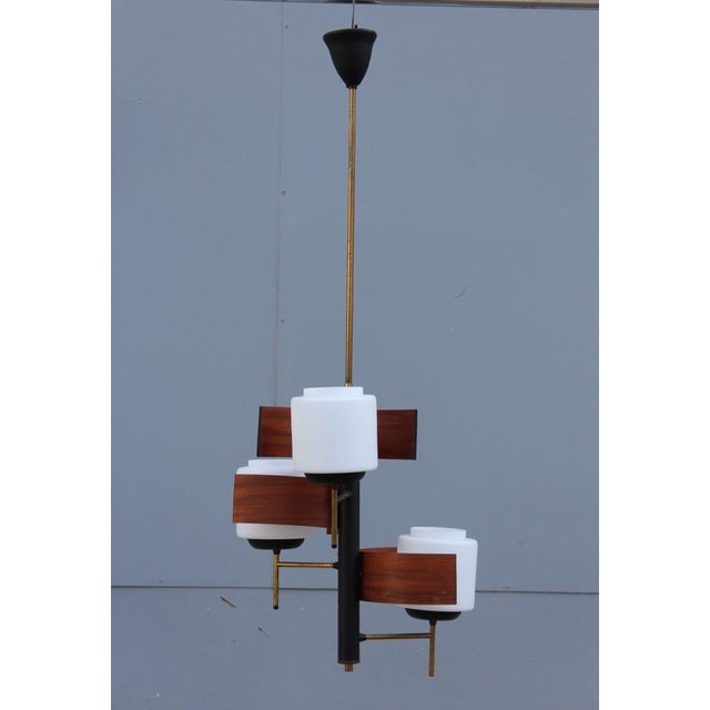 Manufacturer: Esperia DIms.: 15" Diameter x 35"H Origin: Italy Circa: 1950's Esperia mahogany chandelier, mid-century...